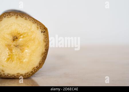 Halved banana on table Stock Photo