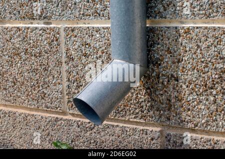 Drain from gray galvanized sheet. Stock Photo