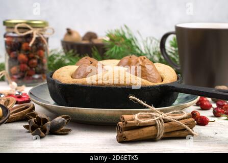 Christmas cake with cinnamon and pear, side view. Stock Photo