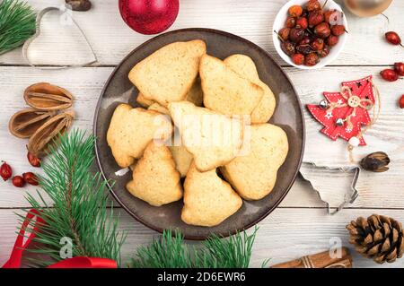 Cookies of different shapes on the Christmas table. Stock Photo