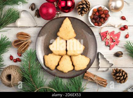 Shortbread cookies on a plate laid out in the shape of a Christmas tree. Stock Photo