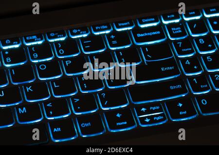 Illuminated blue computer keyboard - laptop, notebook Stock Photo