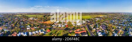 Flat Great Western plains with Dubbo city residential suburbs and streets along Macquarie river in wide aerial panorama. Stock Photo