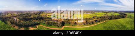 Macquarie river flowing around Dubbo city in Great Western Plains of NSW, Australia - wide aerial panorama. Stock Photo