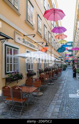 The Sünnhof-Passage with colorful umbrellas, passage and Biedermeier inner courtyard between Landstrasser Hauptstrasse and Ungargasse, 3rd district, Landstrasse, Vienna, Austria Stock Photo