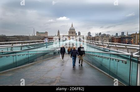 Millennium Bridge with a view of St. Paul's Cathedral on a wet rainy day. Stock Photo