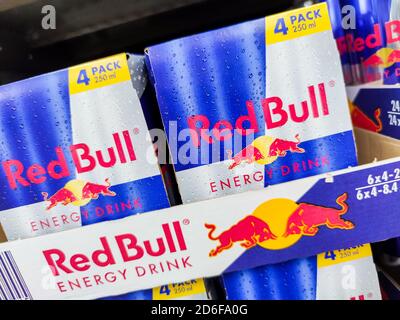 Puilboreau, France - October 14, 2020:Selected Focus on Cans of Red Bull Energy Drink display for sell in the supermarket shelves. Red Bull is the mos Stock Photo
