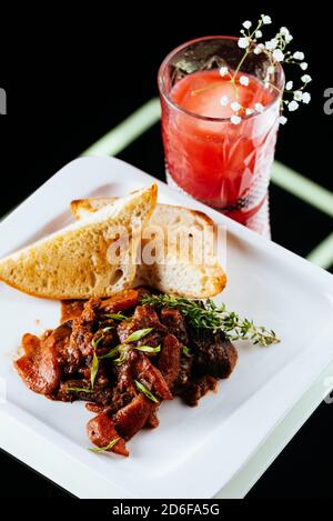 beef goulash on a black background Stock Photo