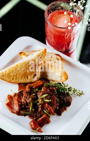 beef goulash on a black background Stock Photo
