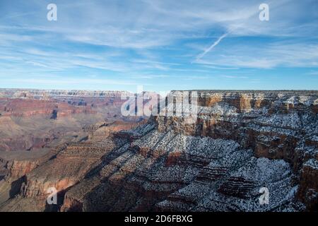 Snow dusted view of south rim of Grand Canyon, north rim in distance Stock Photo