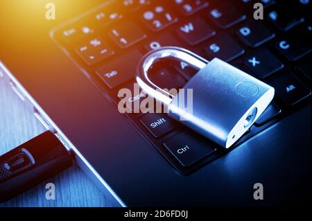 locked padlock on the laptop's keyboard, computer and data security concept. Stock Photo