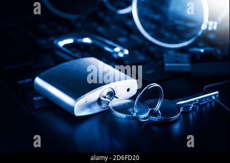 unlocked padlock on the laptop's keyboard, computer and data security concept. Stock Photo