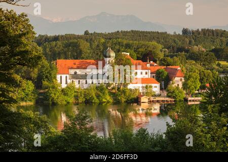 Seeon Abbey on Seeoner See at sunset, Chiemgau, Upper Bavaria, Germany Stock Photo
