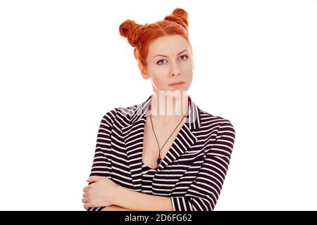 Serious, grumpy wife. Closeup portrait of a cut out beautiful unhappy looking woman wearing striped black white jacket with 2 buns up hairdo isolated Stock Photo