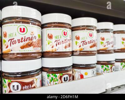 Puilboreau, France - October 14, 2020:Focus on dispenser brand jars of hazelnut cream in french supermaket shelf Stock Photo