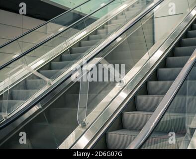 Modern escalator in a metro station in Bucharest. Moving up staircase. Stock Photo