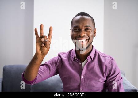 African American Deaf Man Using Sign Language Stock Photo