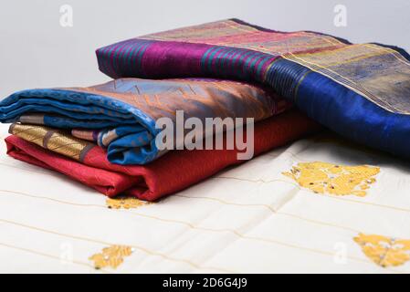 Indian silk sari, handmade white Kerala Sari, woman wearing holding sari, traditional wear on Onam festival, Vishu, wedding in India. multi-colored Stock Photo