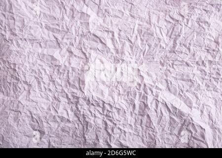 Crumpled paper texture. Twisted purple paper. Seamless pattern. Stock Photo
