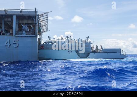 (PHILIPPINE SEA Oct. 4, 2020) Patrol Boat (PB) Mk VI 1206 assigned to Maritime Expeditionary Security Squadron 3 prepares to board amphibious dock landing ship USS Comstock (LSD 45) in preparation for PB Mk VI integration. Maritime Expeditionary Security Force and Explosive Ordnance Disposal Mobile Unit Sailors assigned to Commander, Task Force 75 (CTF 75) embarked and are conducting integrated littoral maritime security operations from the amphibious dock landing ship USS Comstock (LSD 45) with the Marines and Sailors already deployed as Task Force Ellis from I Marine Expeditionary Force. PB Stock Photo