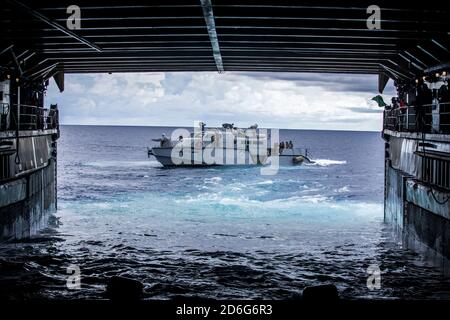 (PHILIPPINE SEA Oct. 9, 2020) Patrol Boat (PB) Mk VI assigned to Commander, Task Force 75 (CTF 75) disembarks amphibious dock landing ship USS Comstock (LSD 45) in preparation for PB Mk VI integration. Maritime Expeditionary Security Force and Explosive Ordnance Disposal Mobile Unit Sailors assigned to Commander, Task Force 75 (CTF 75) embarked and are conducting integrated littoral maritime security operations from the amphibious dock landing ship USS Comstock (LSD 45) with the Marines and Sailors already deployed as Task Force Ellis from I Marine Expeditionary Force. PB Mk VI provide increas Stock Photo