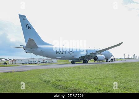 A U.S. Navy Poseidon P-8 aircraft with Patrol Squadron 1 stands by to be refueled during a joint forward arming and refueling point (JFARP). During Exercise Noble Fury 21, Marines with 3rd MLG established and serviced a JFARP in support of U.S. Navy Poseidon P-8 aircraft. This exercise showcased the survivability and lethality of the Navy and Marine Corps  team while operating in a distributed maritime environment. (U.S. Marine Corps photo by Pfc. Courtney A. Robertson Stock Photo