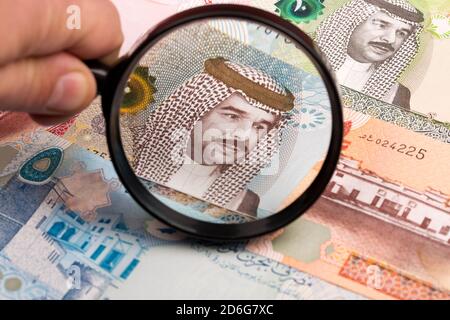 Bahraini dinar in a magnifying glass Stock Photo