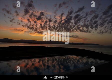 Sunrise at Paros, infinity pool, Naxos on the background Stock Photo