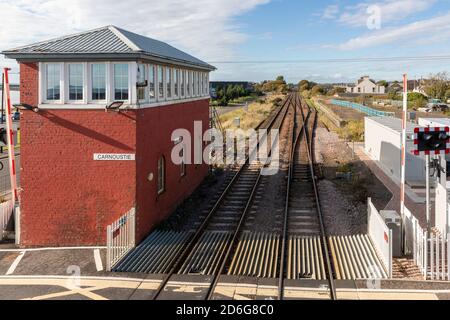 Railway line between Edinburgh and Aberdeen passing through Carnoustie next to an old styled signal box, Carnoustie, Scotland, UK Stock Photo