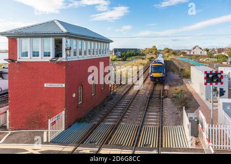 Railway line between Edinburgh and Aberdeen passing through Carnoustie next to an old styled signal box, Carnoustie, Scotland, UK Stock Photo