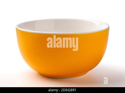 Empty yellow bowl isolated on white background Stock Photo