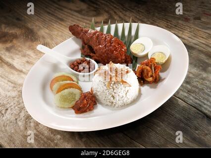 Asian food nasi lemak with chicken in sambal sauce Stock Photo