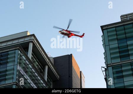 Birmingham, United Kingdom, 17th October 2020. Unusual Saturday morning sight in Birmingham city centre as Super Puma Helicopter conducted load lifts from between the high rise office blocks in Snow Hill Queensway. HeliRig organised the operations utilising a Swiss based Aerospatiale AS332C Super Puma based out of Wolverhampton Halfpenny Green Airport for the duration of the operation which included facilitating a vertical take off trailing an 80m lifting cable. Super Puma operating between the high rise offices in Birmingham Credit:Paul Bunch/Alamy Live News. Stock Photo