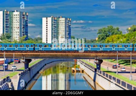 Moscow subway train on the bridge across the Yauza River with tilt shift lens effect Stock Photo