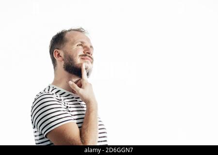 Handsome thinking man over isolated background with one finger, great idea or thought, good memory. Stock Photo