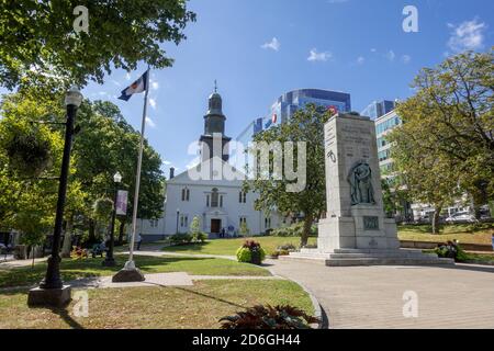St. Paul's Anglican Church The Oldest Building In Halifax  And The Centotaph In The Grand Parade Halifax Nova Scotia Canada Stock Photo