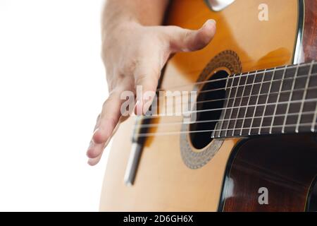 Close up of man's hands playing acoustic guitar flamenco. Music for recreation or hobby concept. Stock Photo