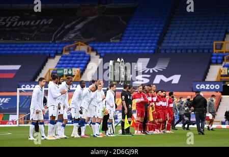 Everton and Liverpool players line up before the Premier League match at Goodison Park, Liverpool. Stock Photo