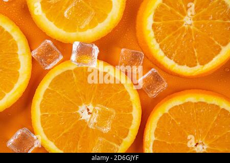 orange slices on a orange background Stock Photo