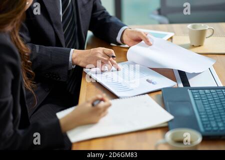 asian corporate executives working together reviewing business in office Stock Photo