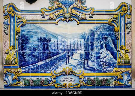 PINHãO, PORTUGAL - Oct 02, 2019: A Typical beautiful Portuguese ceramic tile mural in railway station in Pinhao, Douro Valley, Portugal Stock Photo