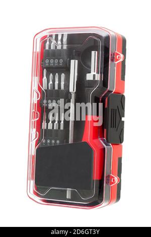 a set of working tools with a screwdriver and bits for repair in transparent plastic box with iron nozzles, an object isolated on a white background s Stock Photo