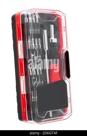 a set of working tools with a screwdriver and bits for repair in transparent plastic box with iron nozzles, an object isolated on a white background s Stock Photo