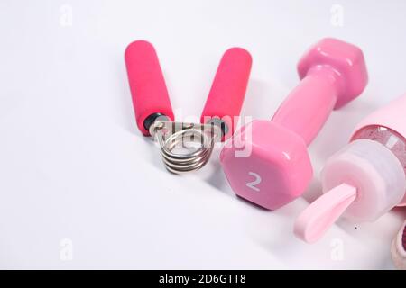 pink color dumbbell and water bottle on white background  Stock Photo