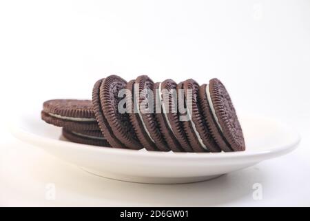 homemade chocolate biscuits on plate isolated on white  Stock Photo