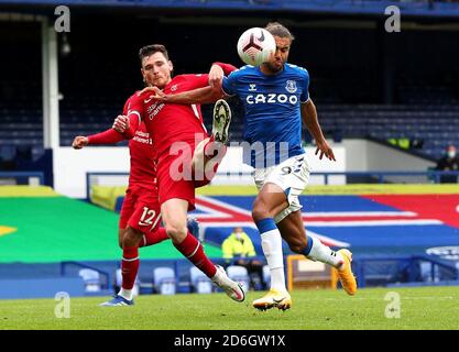 Liverpool's Andrew Robertson (left) and Everton's Dominic Calvert-Lewin battle for the ball during the Premier League match at Goodison Park, Liverpool. Stock Photo