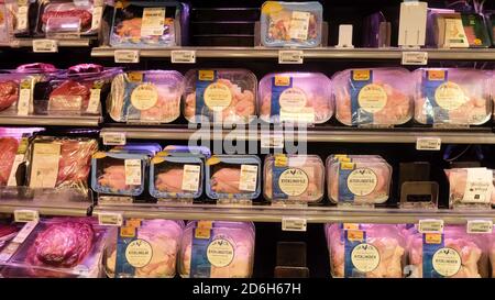 Meat in a fridge shelf at a swedish supermarket : chicken, sausages, beef, salami… Stock Photo