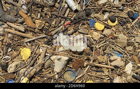 Debris washed ashore with a variety of little things which nature could not break down easy Stock Photo