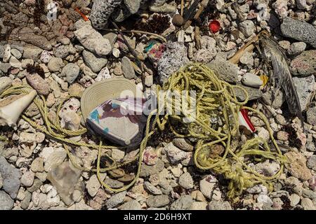 Debris washed ashore with a variety of little things which nature could not break down easy Stock Photo