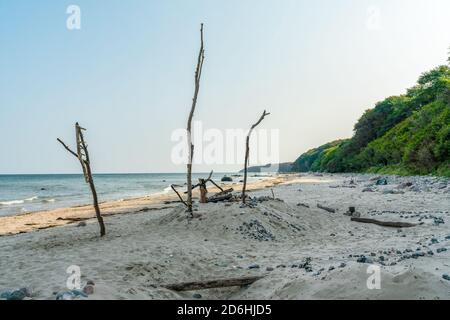 Huge sandcastle with stones and sticks at the beach in Schwarbe on the baltic sea island Ruegen Stock Photo